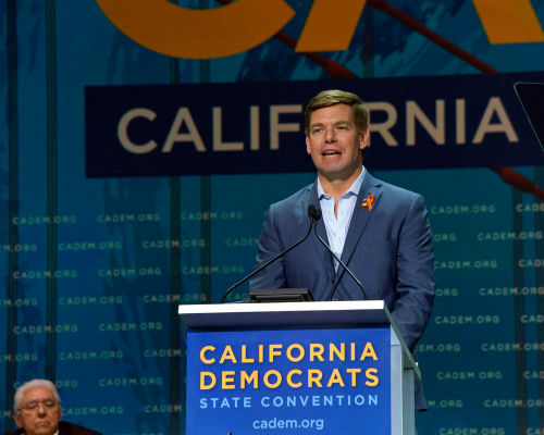 shutterstock_1414003526.jpg Man speaking at California Democrats State Convention podium.