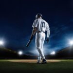 Mayor’s Hug Triggers Mets COLLAPSE — Fans REVOLT… A baseball player standing on the field at night, holding a bat