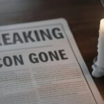 Last ICON DIES — Era Gone Forever… A newspaper with the headline 'BREAKING ICON GONE' next to a lit candle