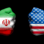 Trump’s Iran ‘Love Tap’ Sparks CHAOS… Two fists painted with Iran and USA flags.
