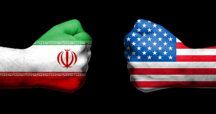 1086543533 Two fists painted with Iran and USA flags.