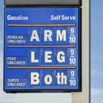 Price Shock Looms — $160 Oil WARNING… Gasoline price sign with humorous mode of payment.
