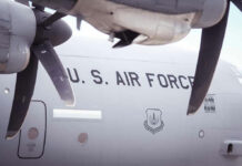 U.S. Air Force airplane with visible propellers and insignia.