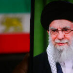 Iran’s War Chest FROZEN—What’s Missing? Person wearing glasses and turban in front of flag