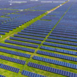 Aerial view of an expansive solar panel farm.
