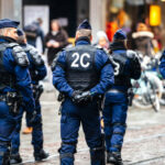 Hate Crime TERROR: Teens ATTACK Mosque! Police officers in uniform gather on a city street