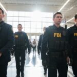 Ex-Spy BETRAYED America to Iran—FBI Hunts Her… FBI agents in tactical gear walking through a supermarket