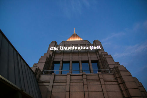 shutterstock_681779896 The Washington Post building against a twilight sky.