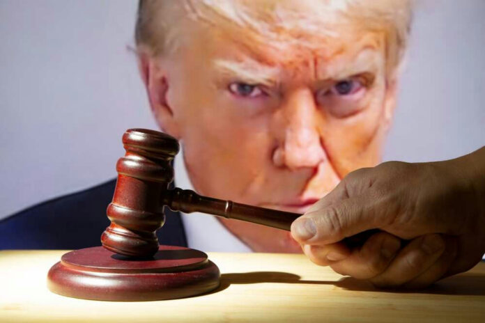 shutterstock2362003039jpg Gavel in foreground, Donald Trump in background, serious expression.