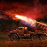 Military truck firing rockets at night.