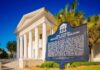 Florida Supreme Court Building with historic marker and white columns