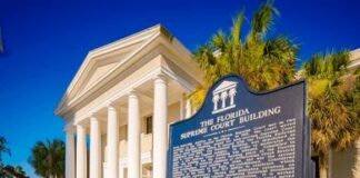 Florida Supreme Court Building with historic marker and white columns