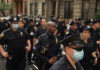 No Navy Parade. Big Accusation Anyway Police officers gathered on a city street