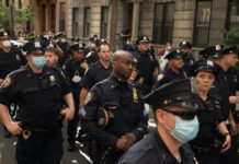 No Navy Parade. Big Accusation Anyway Police officers gathered on a city street
