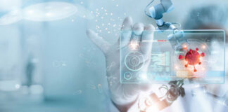 Scientist using robotic arm and digital interface with coronavirus graphic