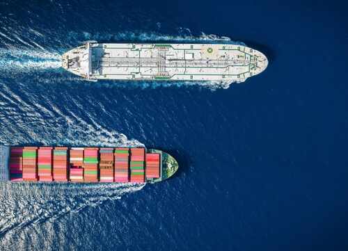 Two cargo ships navigating through the ocean