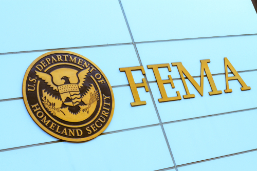 FEMA sign on building with Homeland Security seal.