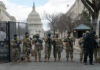 Soldiers standing guard in front of United States Capitol.