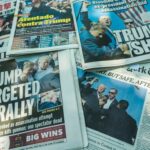 Newspaper headlines about an assassination attempt on Donald Trump.